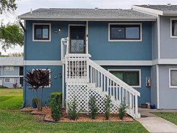 Inviting condo exterior with stairs and landscaping at 6033 34Th W St # 138, Bradenton, FL 34210