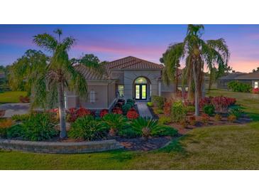 Luxury home with inviting landscaping and walkway at 210 166Th Ne St, Bradenton, FL 34212