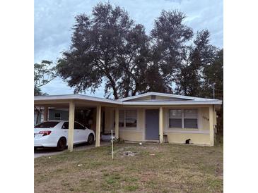 Ranch-style home with carport and small yard at 1519 30Th St, Sarasota, FL 34234