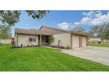 Updated condo with 2-car garage, screened patio, and well-manicured lawn at 205 Oak Hill Dr # 7, Sarasota, FL 34232