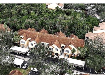 Aerial view of Bella Villino condos, showcasing building exteriors and lush landscaping at 4122 Central Sarasota Pkwy # 1914, Sarasota, FL 34238