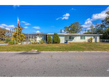 Charming single-story home featuring a well-maintained lawn and a view of the front yard at 217 46Th W St, Bradenton, FL 34209
