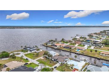 Aerial view of waterfront homes with private docks and boat access at 2468 Quail Ter, Port Charlotte, FL 33981