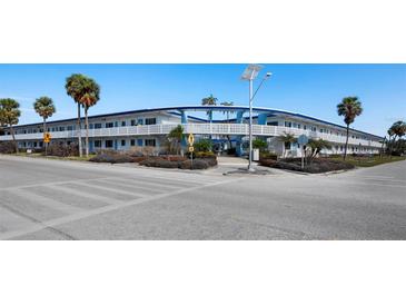Lido Dorset building exterior, featuring a mid-century modern design and ample parking at 475 Benjamin Franklin Dr # 215, Sarasota, FL 34236