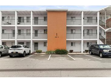 Two-story building exterior with parking and landscaping at 5889 Canal Dr # I4, Bradenton, FL 34207