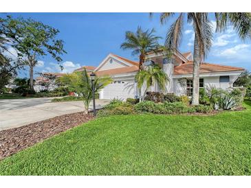 Single-Gathering home with a two-car garage and lush landscaping at 6723 Approach Rd # 35, Sarasota, FL 34238