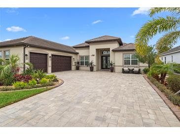 Attractive two-story home with a three-car garage and landscaped yard at 7139 Tamworth Pkwy, Sarasota, FL 34241