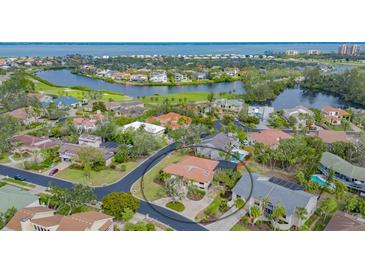 Aerial view of a waterfront home in a luxury community at 3318 Bayou Sound, Longboat Key, FL 34228