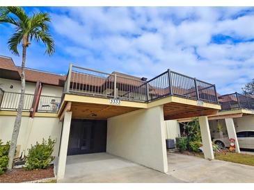 Front view of charming condo with private balcony and carport at 3333 Ramblewood Ct, Sarasota, FL 34237