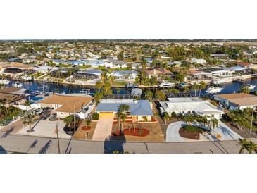 Stunning aerial view of waterfront homes, complete with boat docks and beautiful landscaping at 5207 Bimini Dr, Bradenton, FL 34210