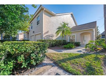 Inviting townhouse featuring well-maintained landscaping, a private entrance and attached garage at 6750 Fairway Gardens Dr # 6750, Bradenton, FL 34203