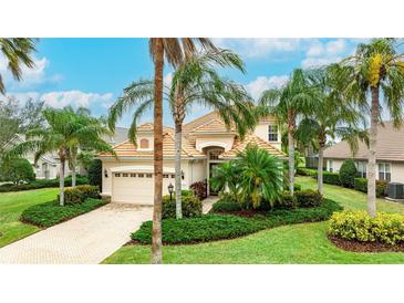 Beautiful one-story home with tile roof and lush landscaping at 7244 Orchid Island Pl, Bradenton, FL 34202