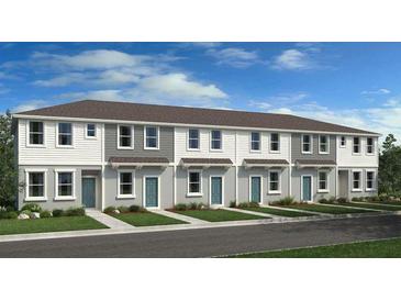 Modern townhome exterior with gray and white siding, and teal doors at 8958 Daybreak St, Sarasota, FL 34241