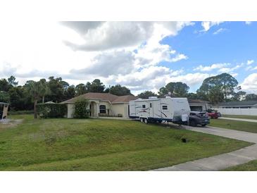 Single-Gathering home with RV parking and a spacious yard at 1649 N Chamberlain Blvd, North Port, FL 34286