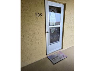 Inviting condo entry with a welcome mat at 3756 Lake Bayshore # 509, Bradenton, FL 34205