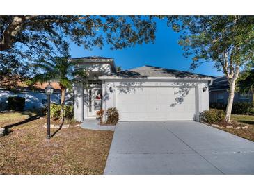 Single-story home with attached garage and landscaped yard at 6334 Yellowtop Dr, Lakewood Ranch, FL 34202