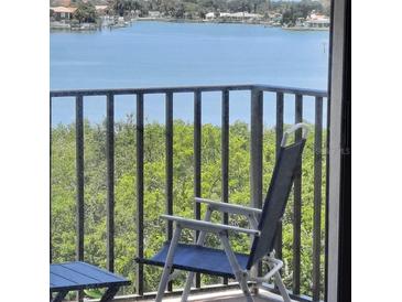 Enjoy breathtaking water views from this expansive balcony at 7050 Sunset S Dr # 601, South Pasadena, FL 33707