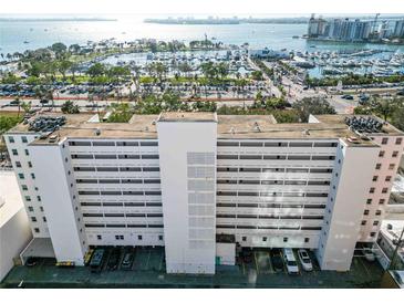 Aerial view of a white building with waterfront and city views at 33 S Gulfstream Ave # 808, Sarasota, FL 34236