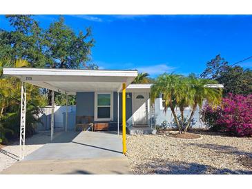 Cute bungalow with carport, and a landscaped front yard at 2335 Novus St, Sarasota, FL 34237