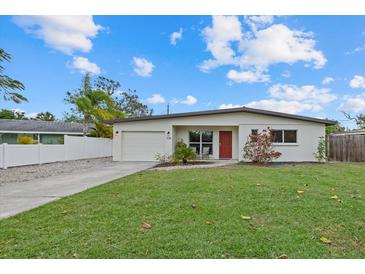 Newly renovated home with modern facade and well-manicured lawn at 330 Caruso Pl, Sarasota, FL 34237