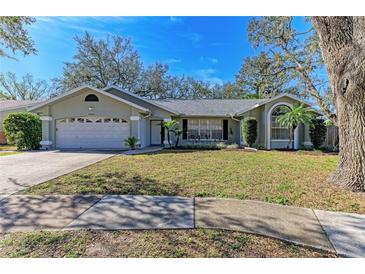 Single-story house with attached garage and well-maintained lawn at 4822 30Th Street E Ct, Bradenton, FL 34203