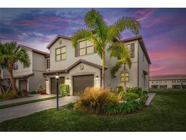 Two-story townhome with attractive landscaping and two-car garage at 15147 Lyla Ter, Bradenton, FL 34211