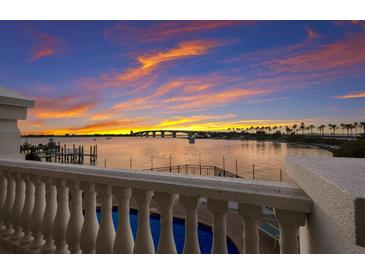 Stunning sunset over the water, seen from a private balcony at 166 Golden Gate Pt # 21, Sarasota, FL 34236