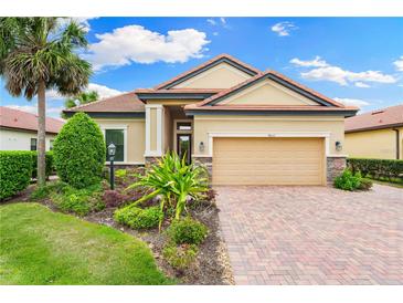 Beautiful one-story home with landscaped yard and two-car garage at 4653 Royal Dornoch Cir, Bradenton, FL 34211