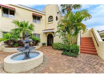 Spanish style building exterior with fountain and lush landscaping at 6101 34Th W St # 28B, Bradenton, FL 34210