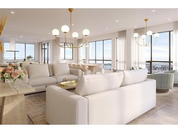 Bright living room with city views, plush sofas, and modern light fixtures at 33 S Palm Ave # 1601, Sarasota, FL 34236