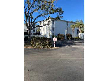 White two-story building with parking lot and landscaping at 6304 Pointe West Blvd # A203, Bradenton, FL 34209