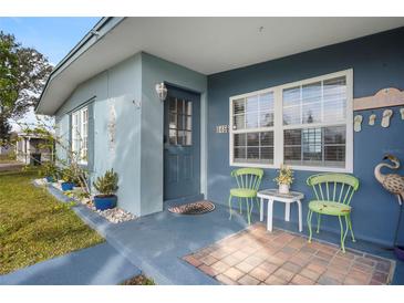 Inviting front porch with seating and coastal decor at 8466 Maureen Ave, North Port, FL 34287