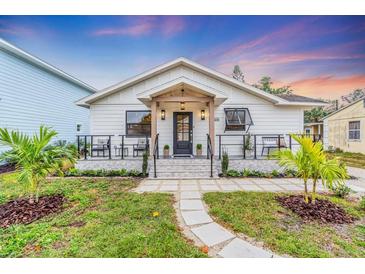 Charming craftsman style home with a welcoming front porch and landscaped yard at 2226 Arlington St, Sarasota, FL 34239