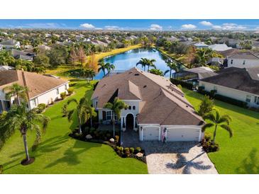 Luxury home with pool and lake view in a tranquil community at 4610 Balboa Park Loop, Lakewood Ranch, FL 34211