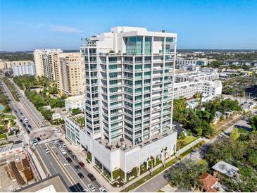 Aerial view of a modern highrise building in a city setting at 540 N Tamiami Trl # 702, Sarasota, FL 34236