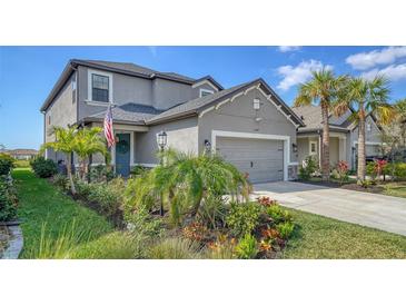 Charming two-story home with landscaped yard and an attached two car garage at 10109 Milky Way Cir, Sarasota, FL 34241