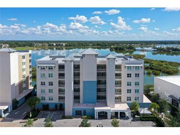 Luxury waterfront condo building with stunning lake views and resort-style amenities at 10510 Boardwalk Loop # 404, Lakewood Ranch, FL 34202