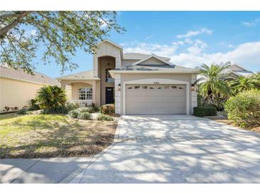 Two-story house with attached garage and landscaped lawn at 11124 Sanctuary Dr, Bradenton, FL 34209