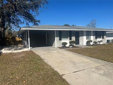 Newly renovated home with a carport and well-maintained landscaping at 2807 W 52Nd Ter, Bradenton, FL 34207