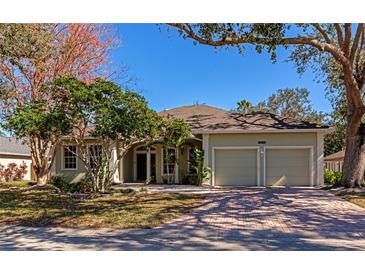 Attractive single-story home with a two-car garage and well-maintained landscaping at 4679 Country Manor Dr, Sarasota, FL 34233