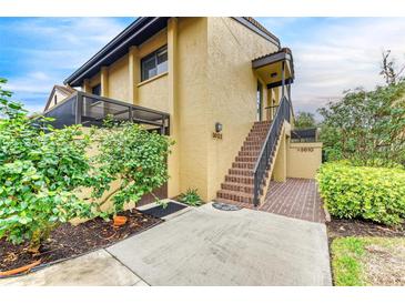 Condo entry with stairs and landscaping at 5612 Ashton Lake Dr # 5612, Sarasota, FL 34231