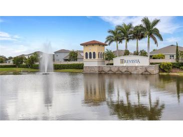 Gated community entrance with water fountain and palm trees at 5703 Tripoli Dr, Palmetto, FL 34221