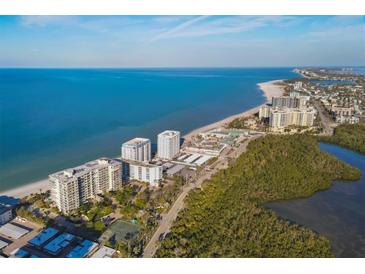 Aerial view of Lido Harbour Towers, showcasing its location on the beach and surrounding area at 1770 Benjamin Franklin Dr # 407, Sarasota, FL 34236