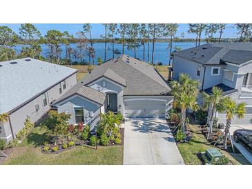 Single-Gathering home with lake view, two-car garage, and landscaped yard at 6347 Grandview Hill Ct, Bradenton, FL 34203