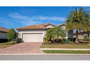 Single-story home with a two-car garage and attractive landscaping at 7123 Marsh View Terrace Ter, Bradenton, FL 34212