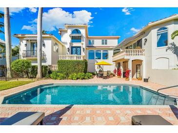 Inviting pool area with ample deck space and lush landscaping at 1023 Tocobaga Ln, Sarasota, FL 34236