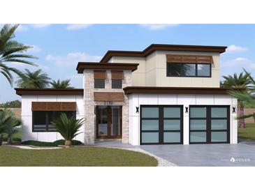 Modern two-story home with two-car garage and landscaped lawn at 2182 Wisteria St, Sarasota, FL 34239