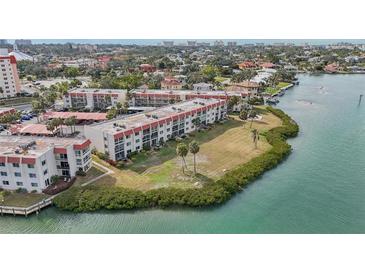 Aerial view of waterfront condo community with lush landscaping and boat access at 250 Santa Maria St # 120, Venice, FL 34285