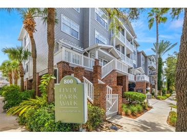 Attractive 3-story condo building with landscaping and sidewalk at 800 S Dakota Ave # 329, Tampa, FL 33606