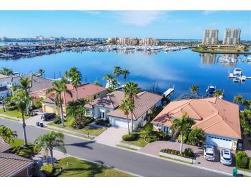 Aerial view of waterfront homes with private docks and lush landscaping at 129 12Th E Ave, Palmetto, FL 34221